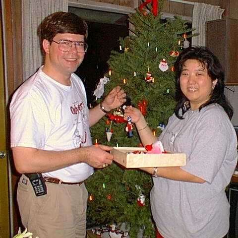 Cheryl and Mark hanging ornaments