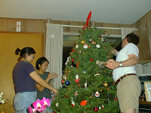 Gail, Judy, and Mark hanging icicles