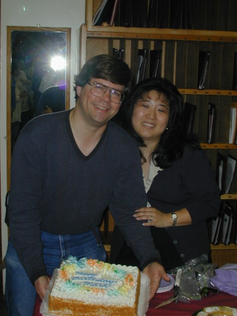 Cheryl & Mark with cake at choir rehearsal