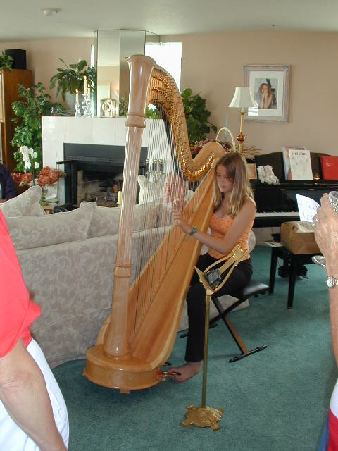 Karen playing the harp