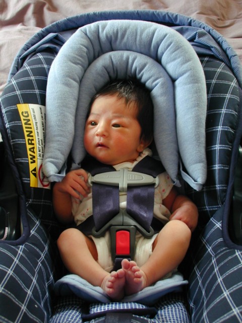 Lura in car seat, at six days