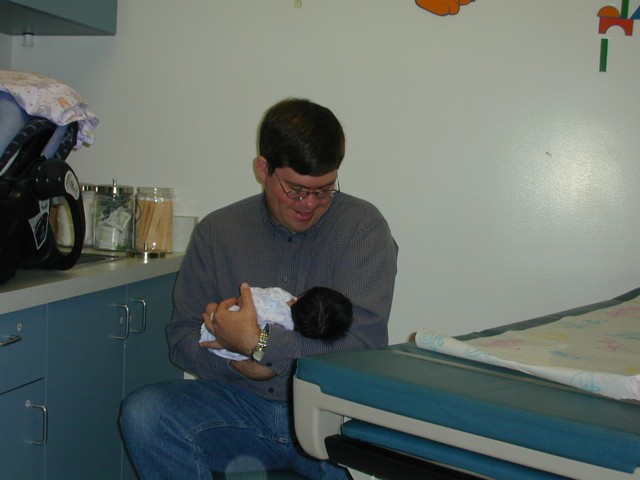 Daddy and Lura in pediatrician's office