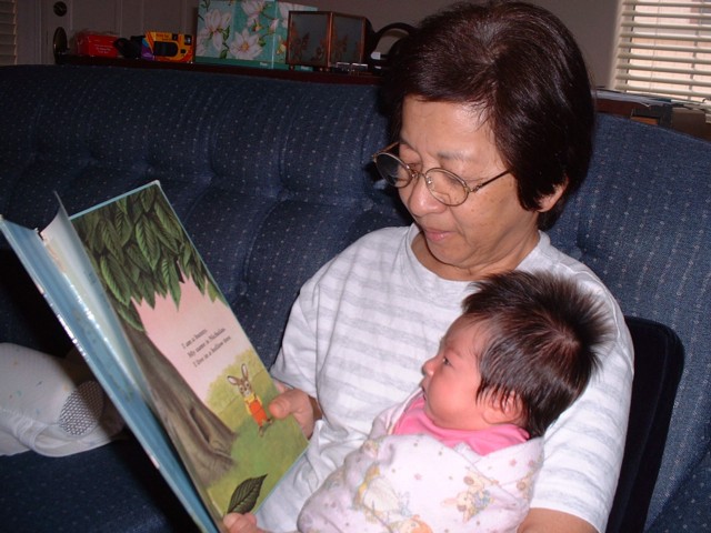 Grandma reading to Lura