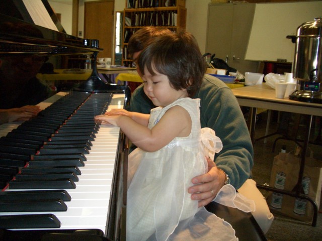 At the piano in the choir room